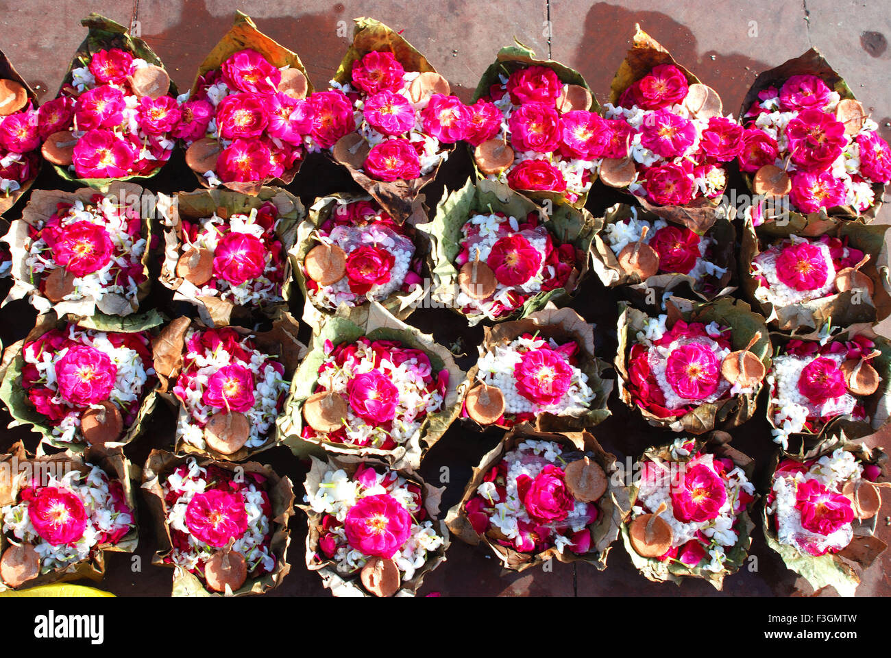 Leaf cups full of flowers ; Haridwar ; Uttar Pradesh ; India Stock Photo
