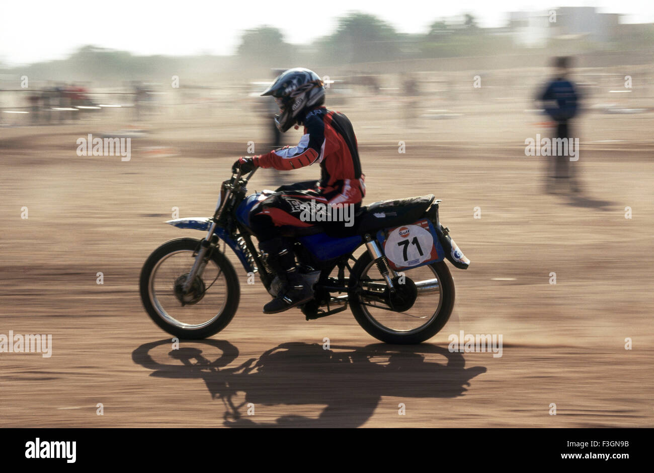 Racing ; rider speeding dirt bike in gulf national bike competition