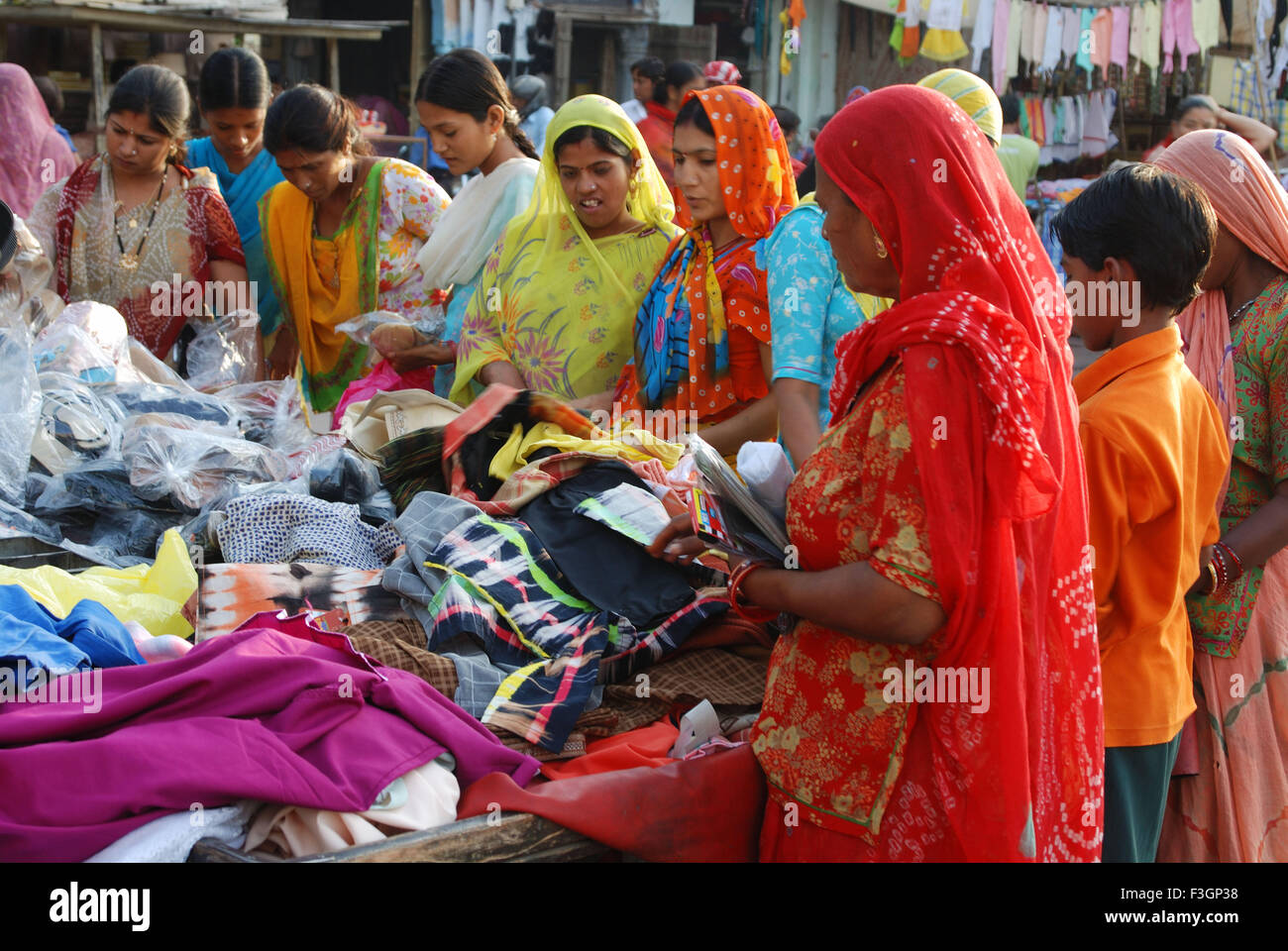 Women buying garments ; Haridwar ; Uttar Pradesh ; Uttarakhand ; India ; Asia Stock Photo