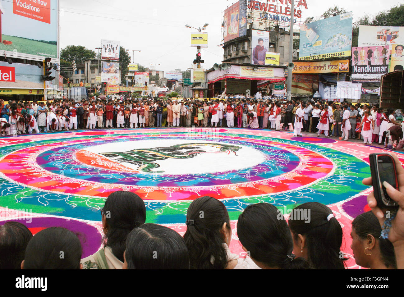 Huge circular artwork called rangoli traditional cultural and heritage art of India ; Pune ; Maharashtra ; India Stock Photo