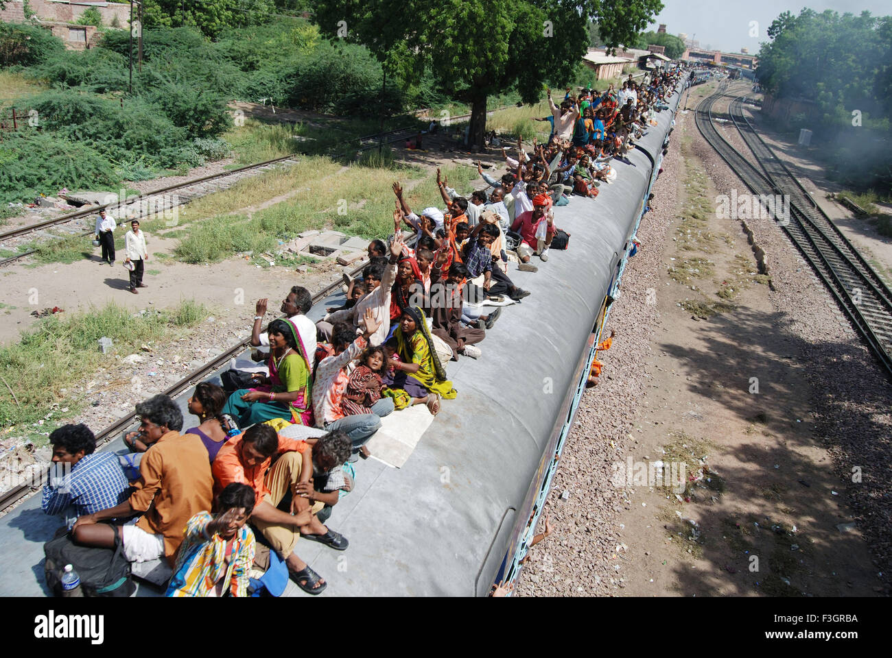 People sitting on roof of train ; Jodhpur ; Rajasthan ; India Stock ...