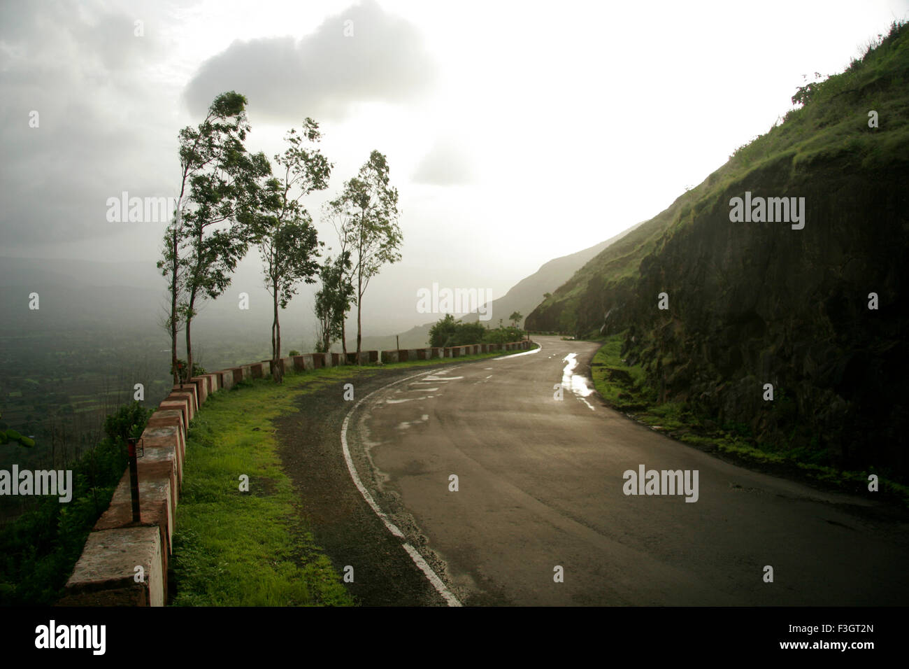 Windy monsoon landscape on winding road of pasarani ghat connecting hill station of Panchgani and Wai ; Maharashtra ; India Stock Photo