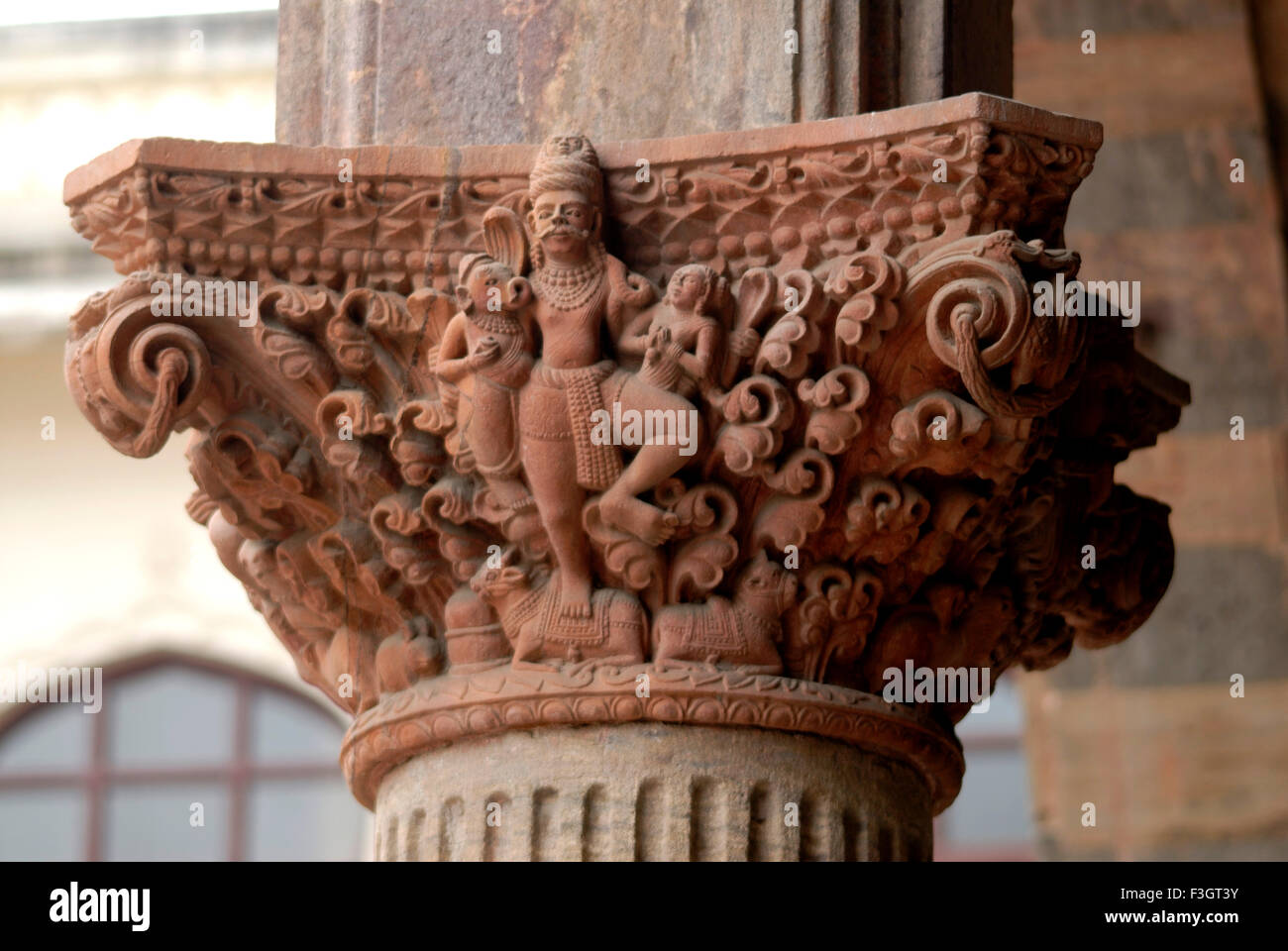 Idol of god Shankar Ganesh and Parvati carved on decorative pillar of old palace of Indore ; Madhya Pradesh ; India Stock Photo