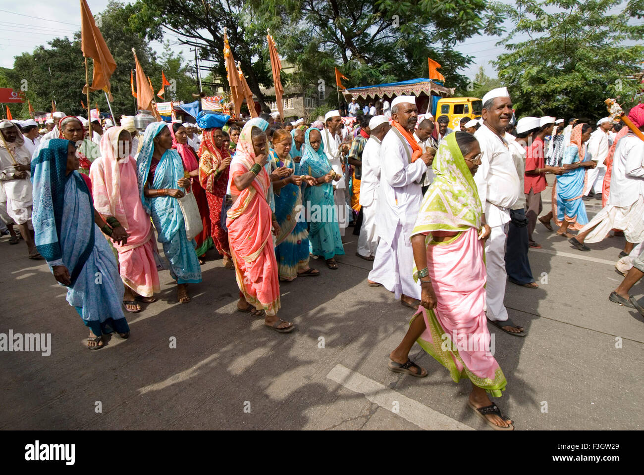 Group of village people on pilgrimage of vari ; procession from Alandi to Pandharpur in Maharashtra ; India Stock Photo