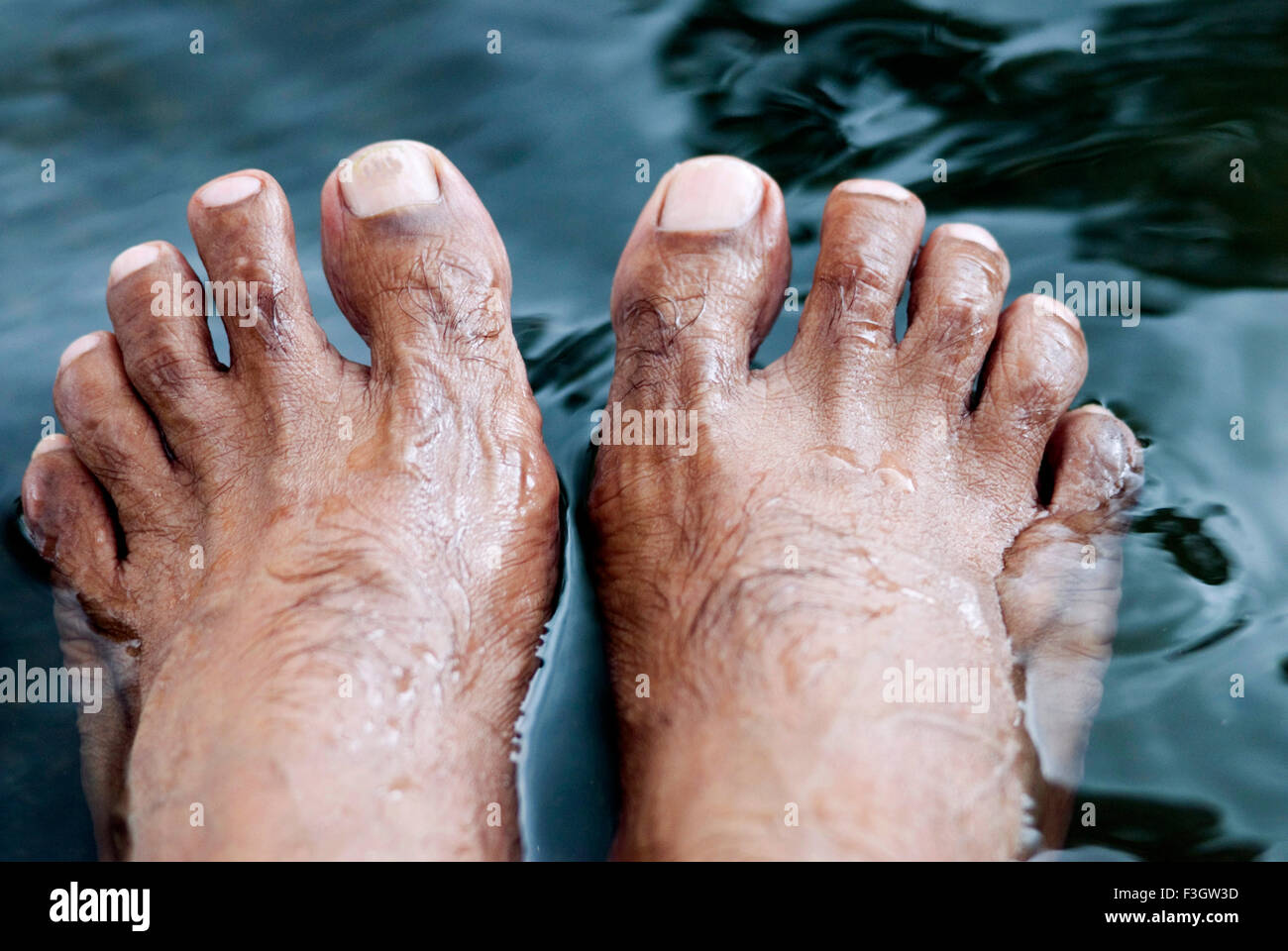 Stretching legs in water wet foot Stock Photo Alamy