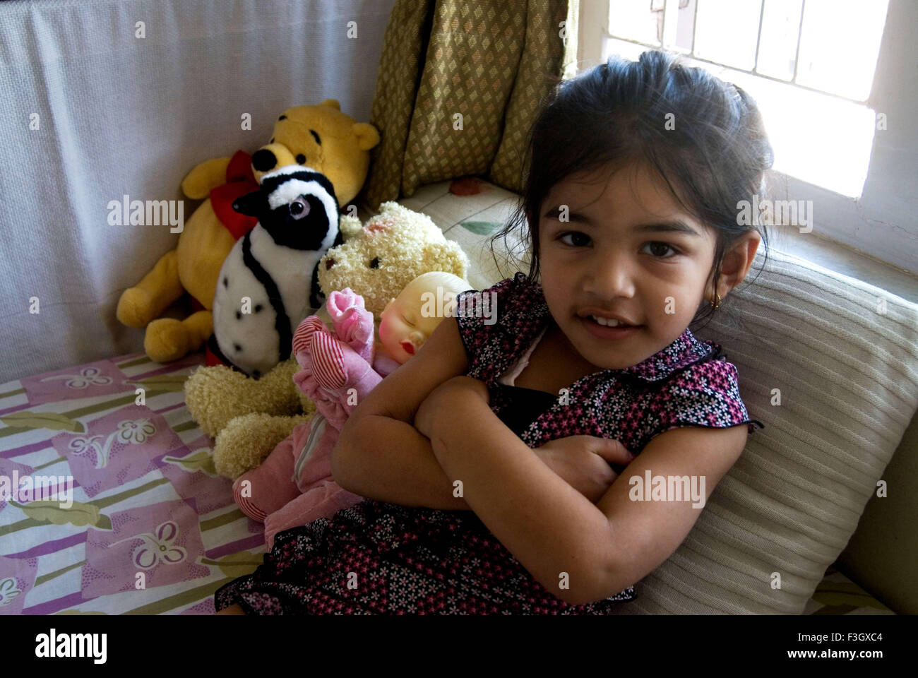 Four years old girl with her toys MR#556 Stock Photo