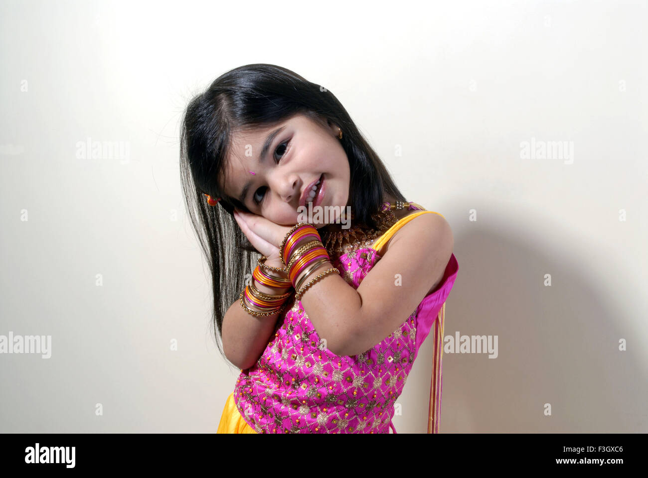 Four years old girl showing sleeping pose MR#556 Stock Photo