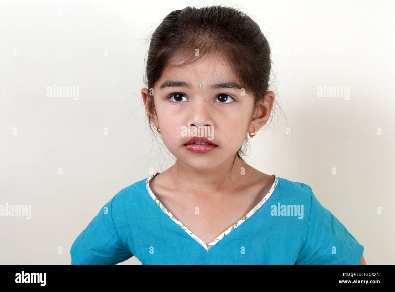 Four years old girl in quizzically mood MR#556 Stock Photo
