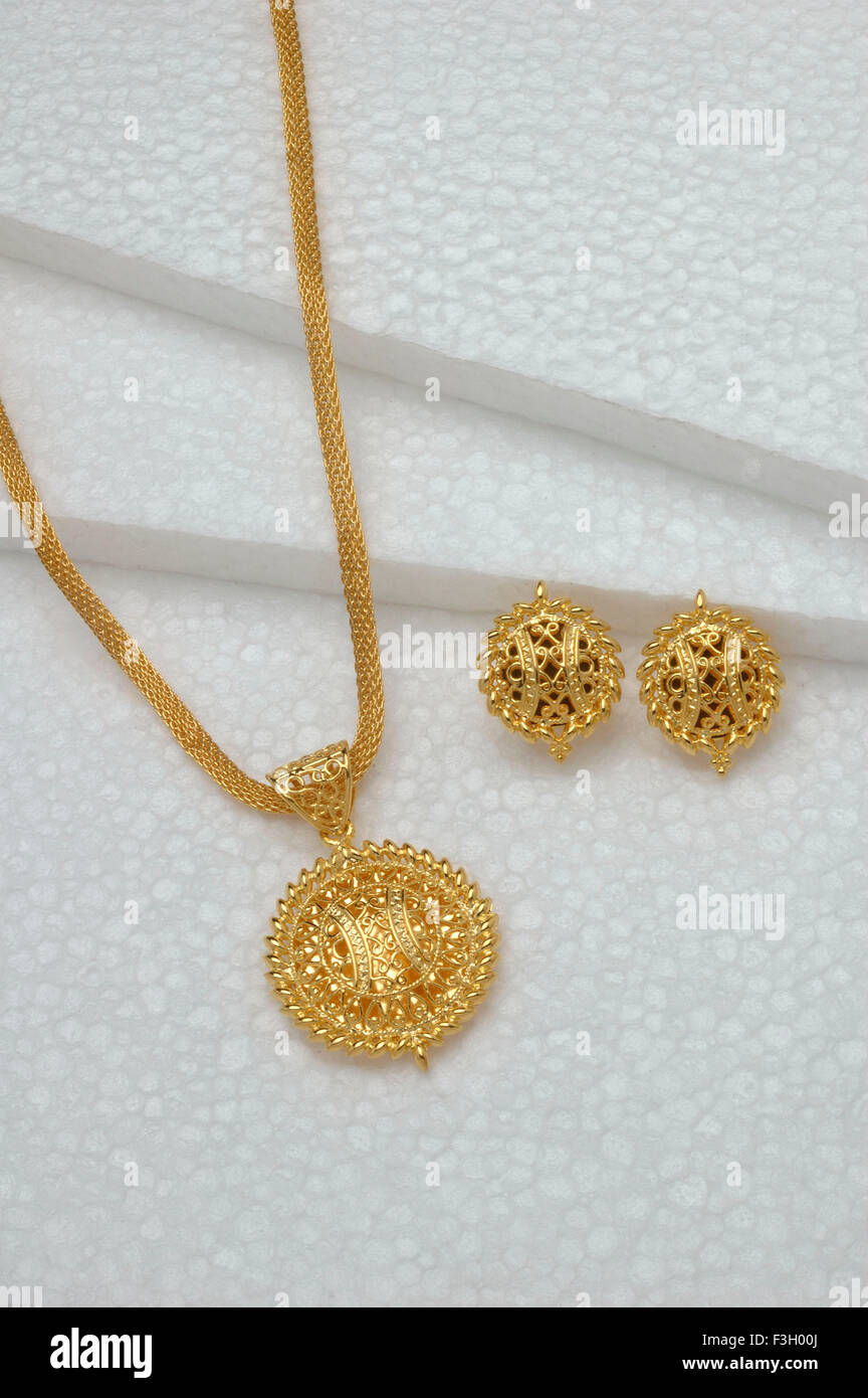 Gold jewellery pendant with earring set Stock Photo Alamy