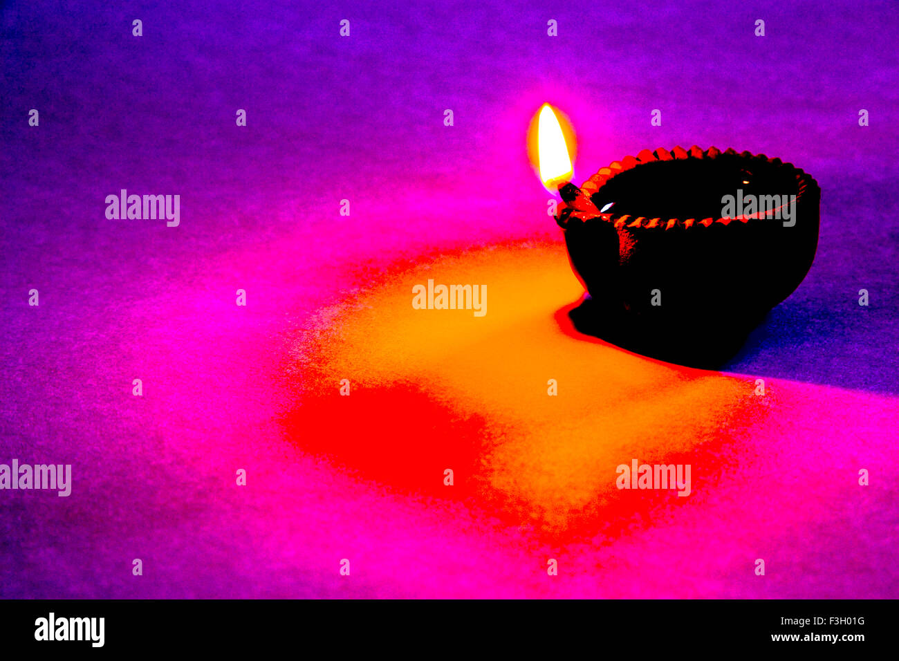 Fine art ; single one diya clay oil lamp a source of light as flame on