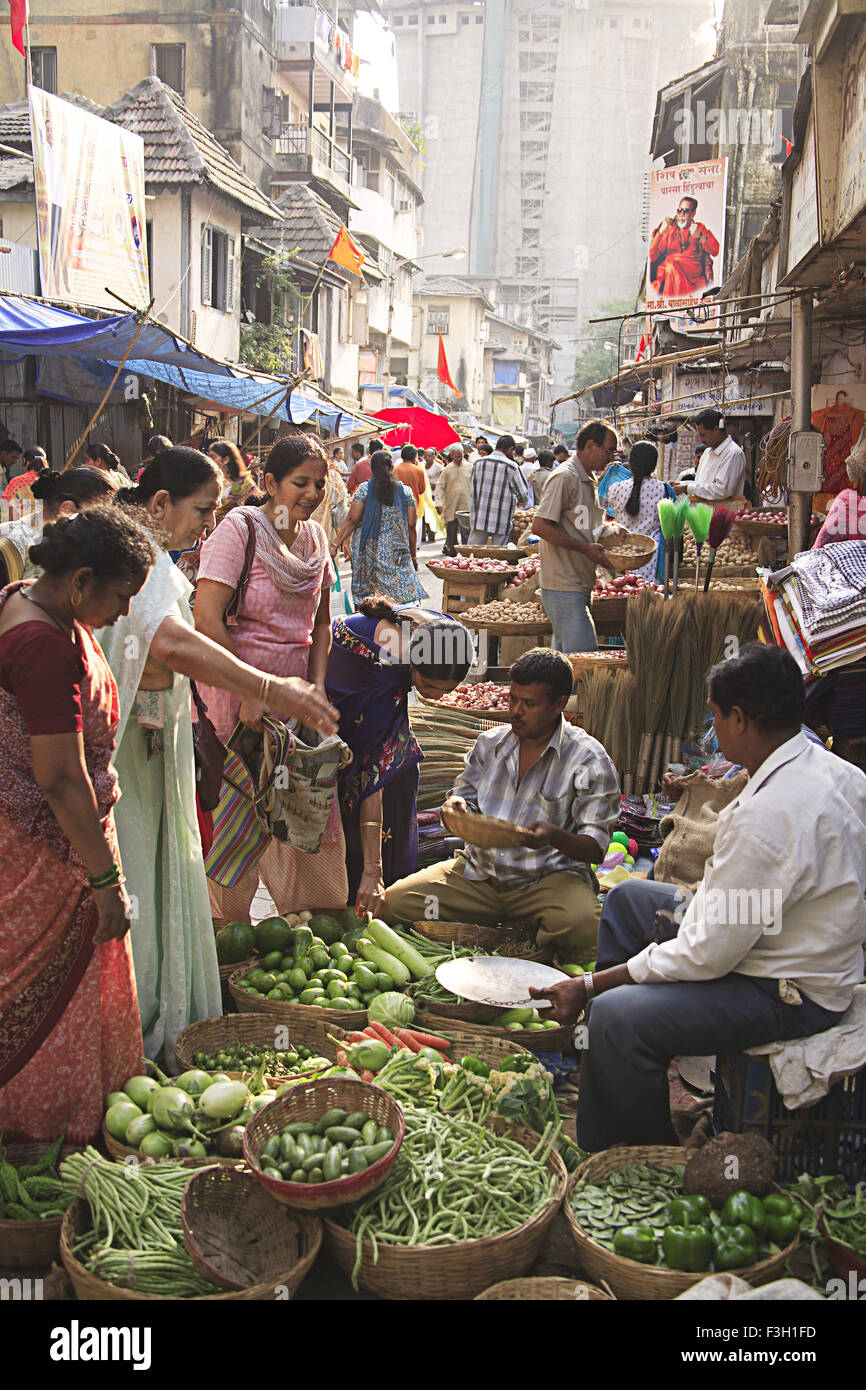 Market Grant road Bombay now Mumbai Maharashtra India indian markets women buying green vegetables Stock Photo
