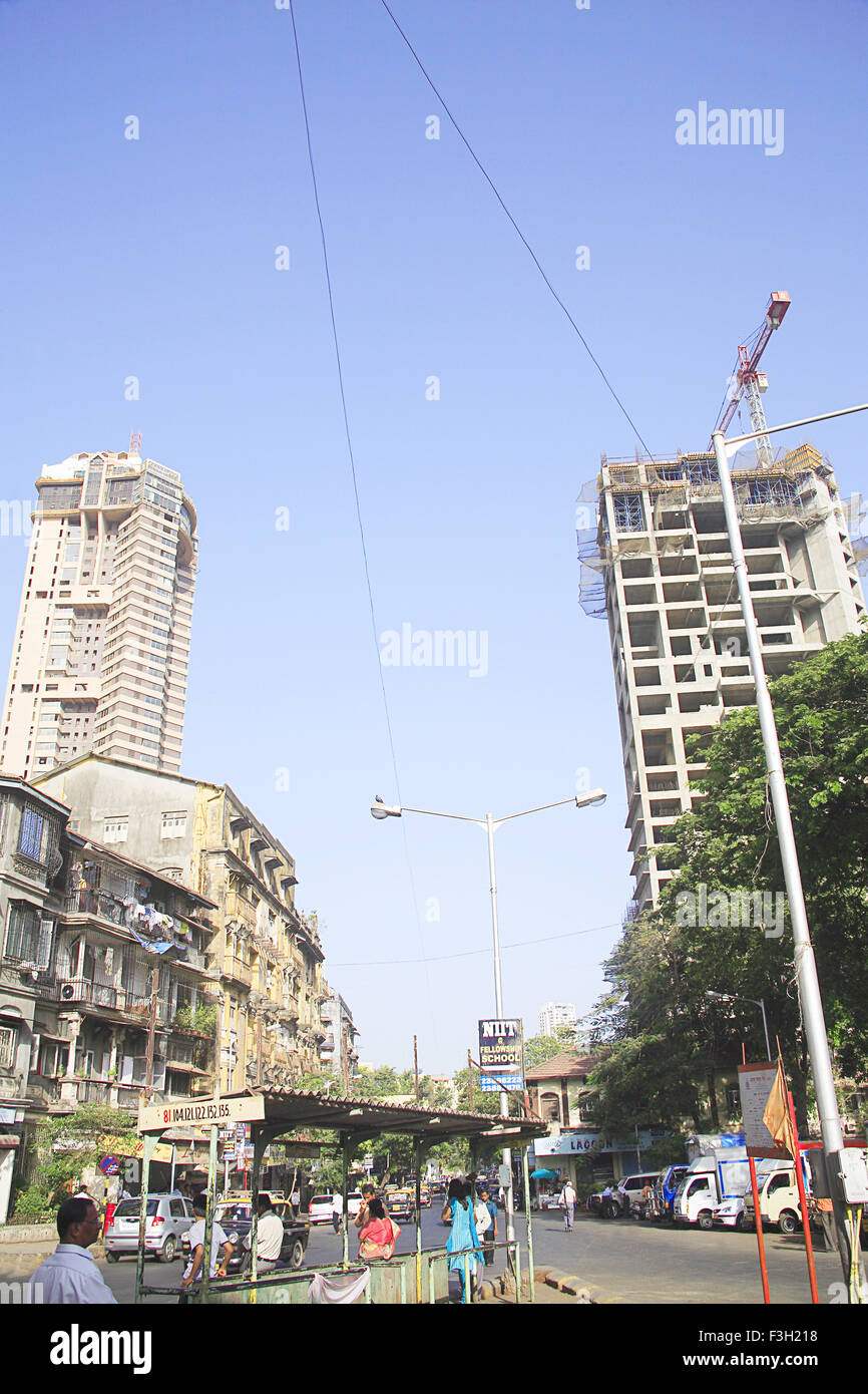 Chawl mass urban housing and construction of skyscraper ; August kranti marg ; Grant Road ; Bombay Mumbai ; Maharashtra ; India Stock Photo