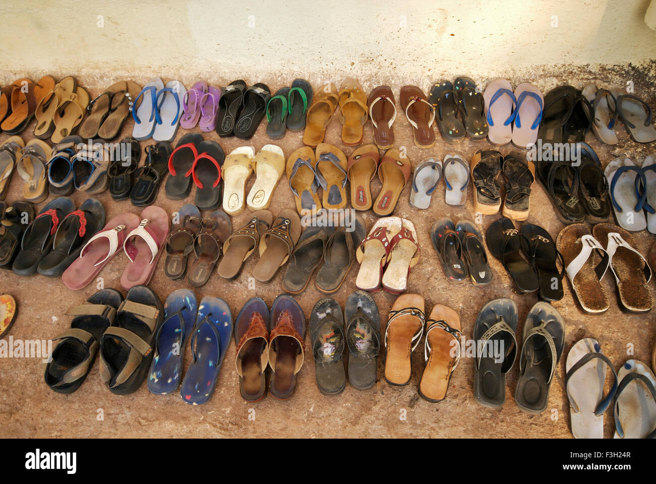 Footwear outside temple ; Goa ; India Stock Photo