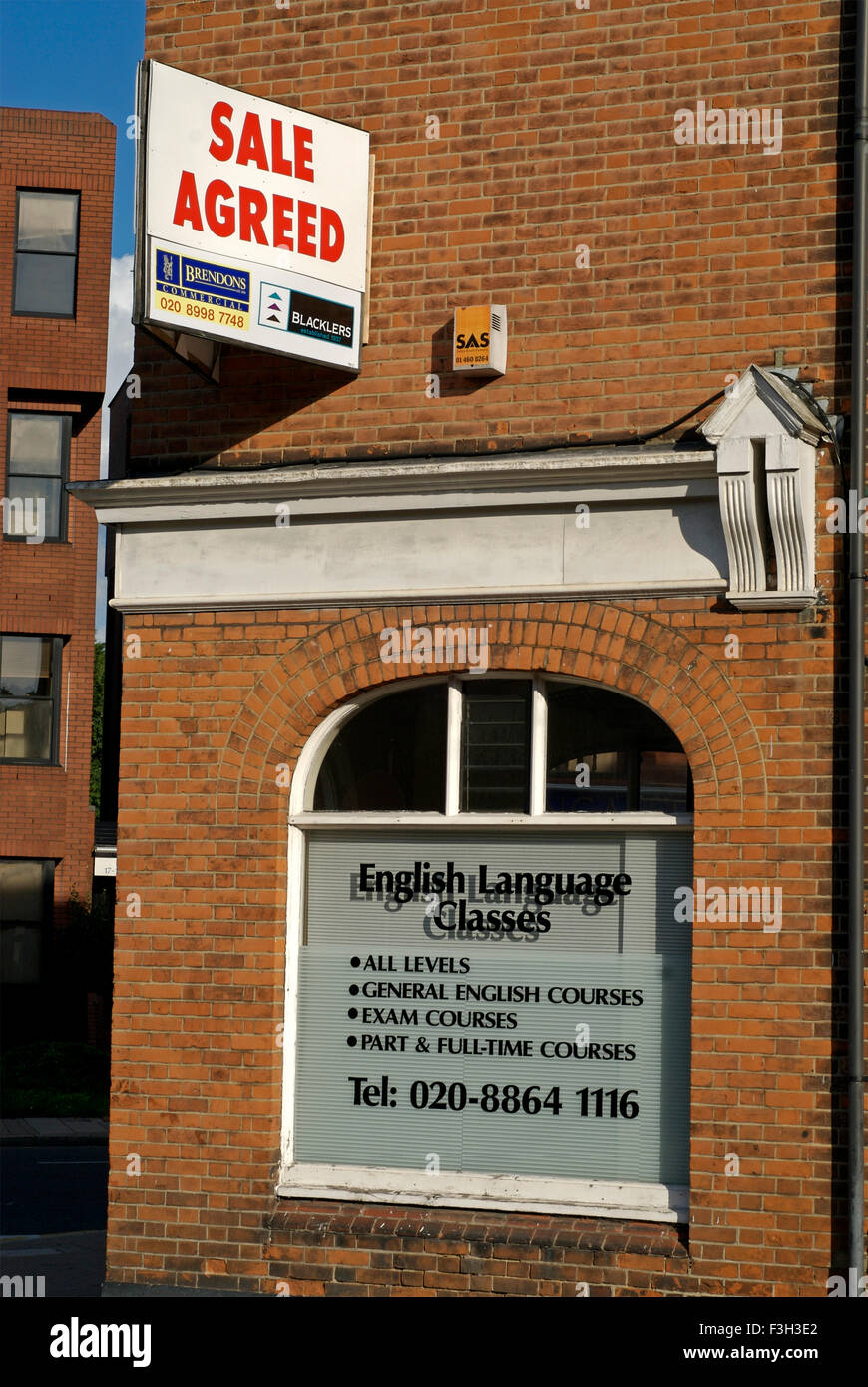 Sale agreed banner on the wall of building ; Harrow On The Hill London