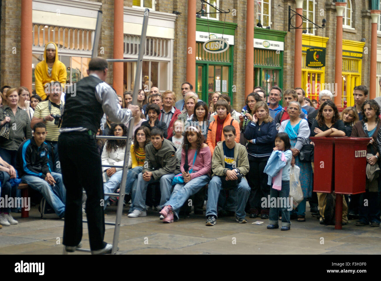 People watching street performance, Covent Garden, London, England, United Kingdom, UK Stock Photo