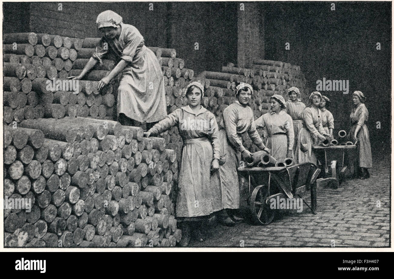 Women munition workers stacking a reserve of shell castings during WWI. Stock Photo