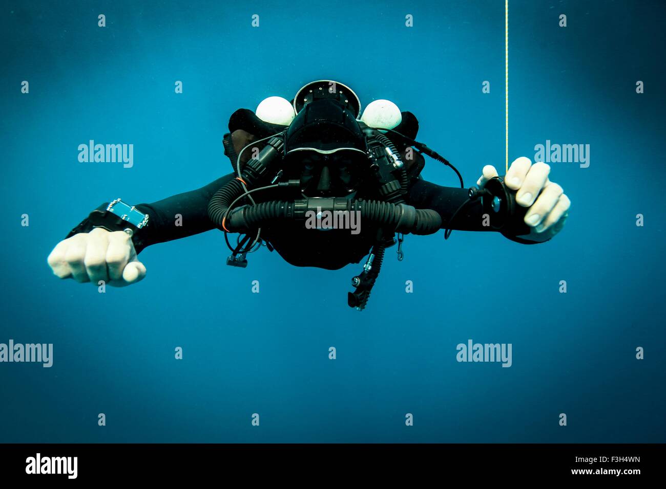 Technical diver performs a decompression stop whilst using a rebreather device, Lombok, Indonesia Stock Photo