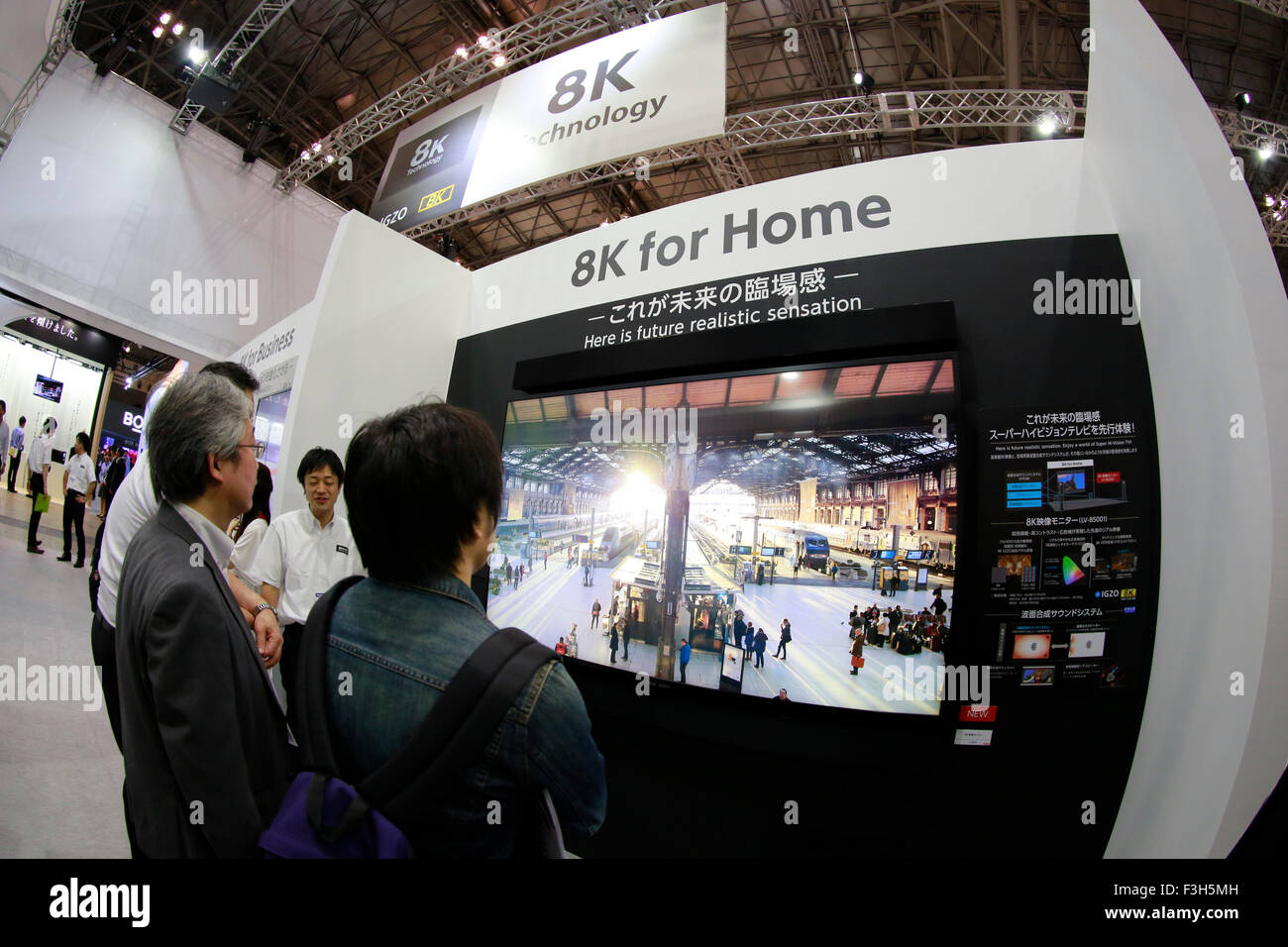 Visitor look at the Sharp's 8K resolution TV at CEATEC Japan 2015 on October 7, 2015, Tokyo, Japan. CEATEC Japan is an electronics and IT exhibition, showing the latest technology in various fields such as transport, healthcare and robotics. This year there are 531 exhibitors from 19 different countries at the exhibition which runs from October 7 to 10. © Rodrigo Reyes Marin/AFLO/Alamy Live News Stock Photo