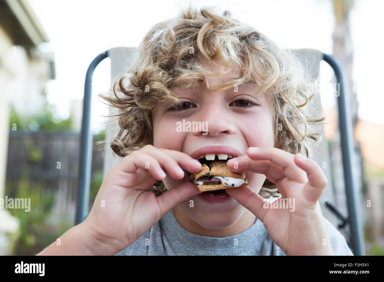 Close up portrait of boy eating a snack Stock Photo Alamy
