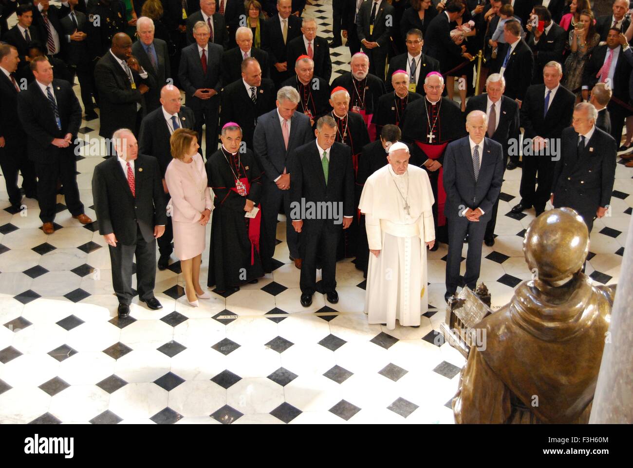 Pope Francis along with members of Congress and Vice President Joe Biden attend the blessing of the St. Junipero Serra statue during a visit to the United States Capitol September 24, 2015 in Washington, DC. Pope Francis is the first pontiff to address a joint meeting of Congress. Stock Photo
