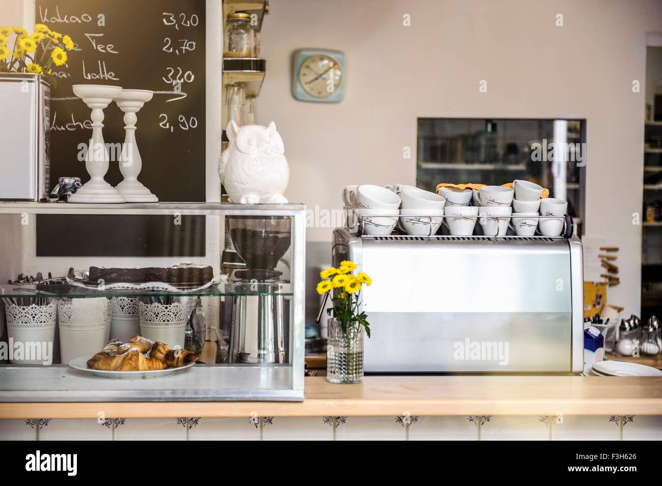 Cafe counter with coffee machine and food display cabinet Stock Photo