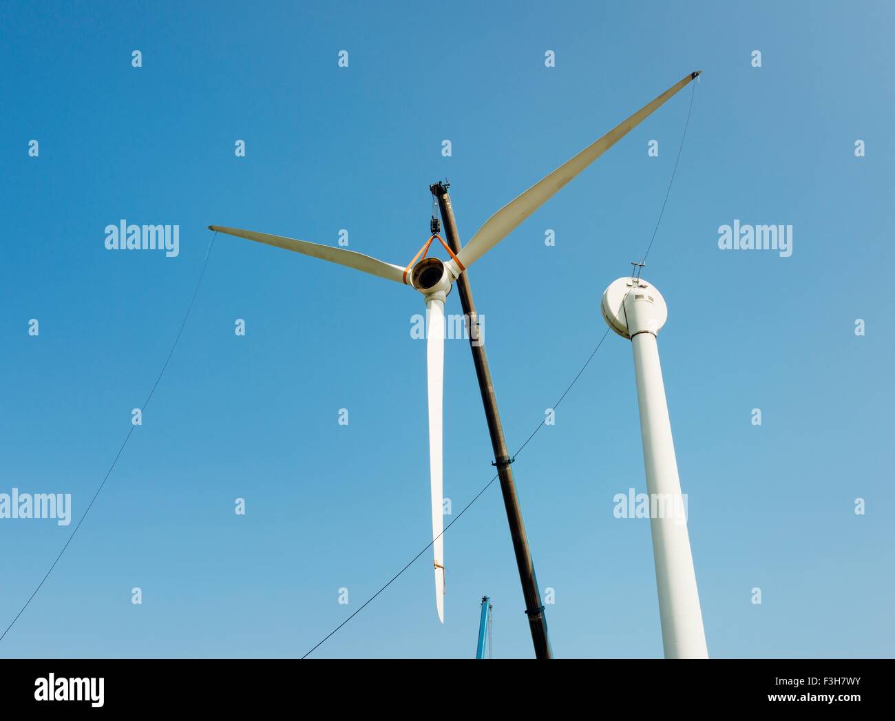 Low angle view of wind turbine being dismantled Stock Photo