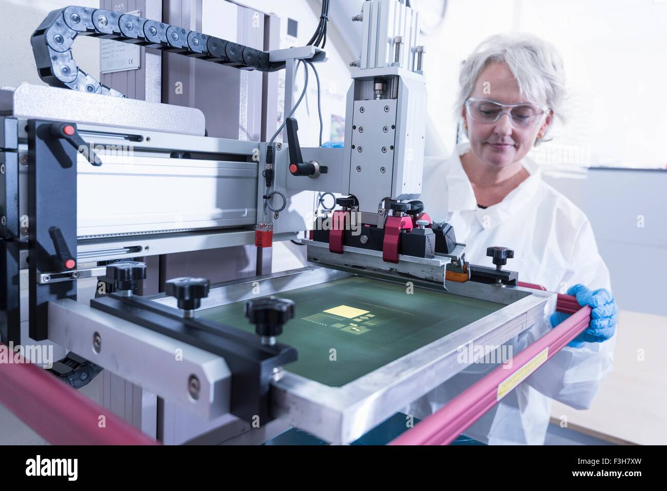 Scientist printing graphene ink test in graphene processing factory Stock Photo