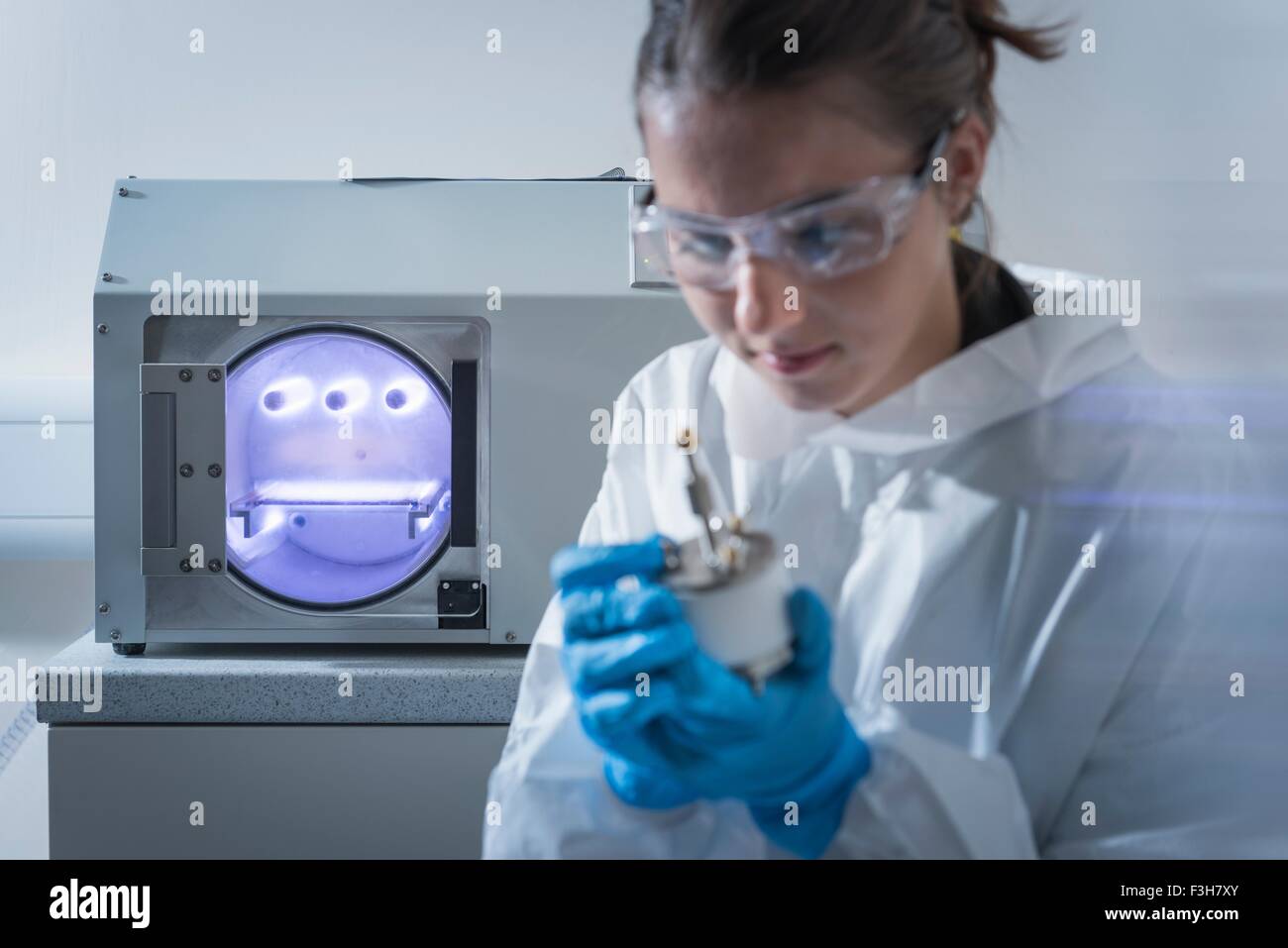 Substrate plasma treatment in graphene processing factory Stock Photo