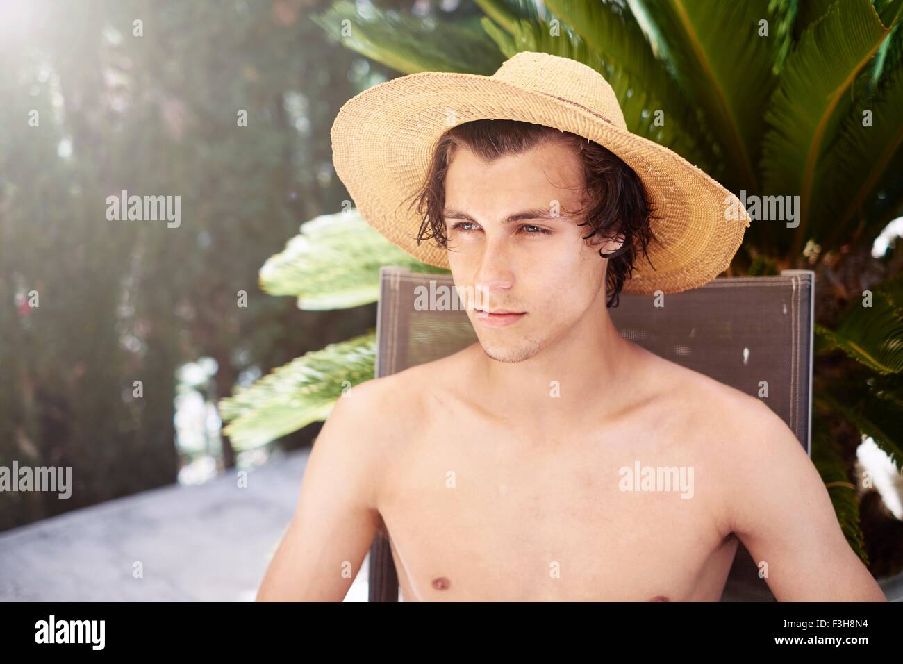 Portrait of young man wearing sunhat Stock Photo