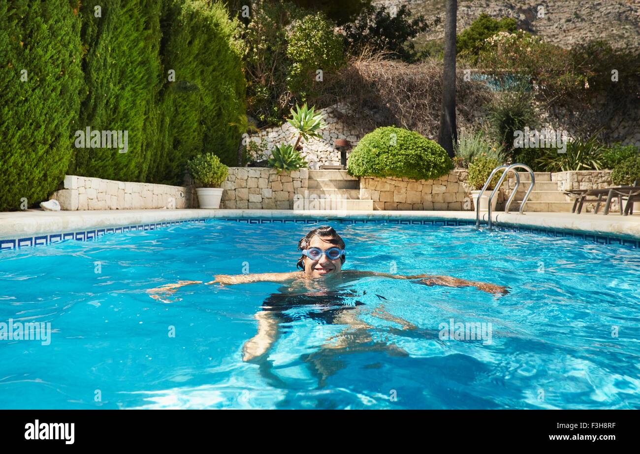 Portrait of young man in swimming pool Stock Photo