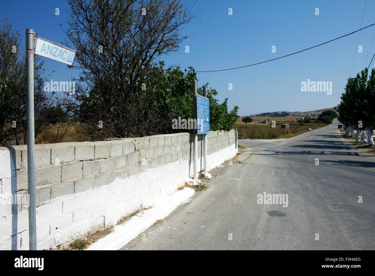 The begining of Anzac street and its road sign (right) pointing to the Commonwealth War Graves Commission East Mudros cemetery. Stock Photo
