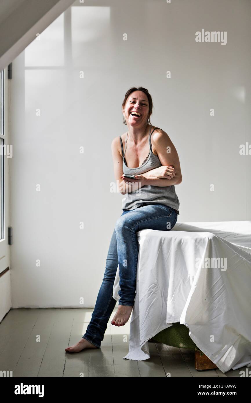 Mature woman laughing home hi-res stock photography and images - Alamy