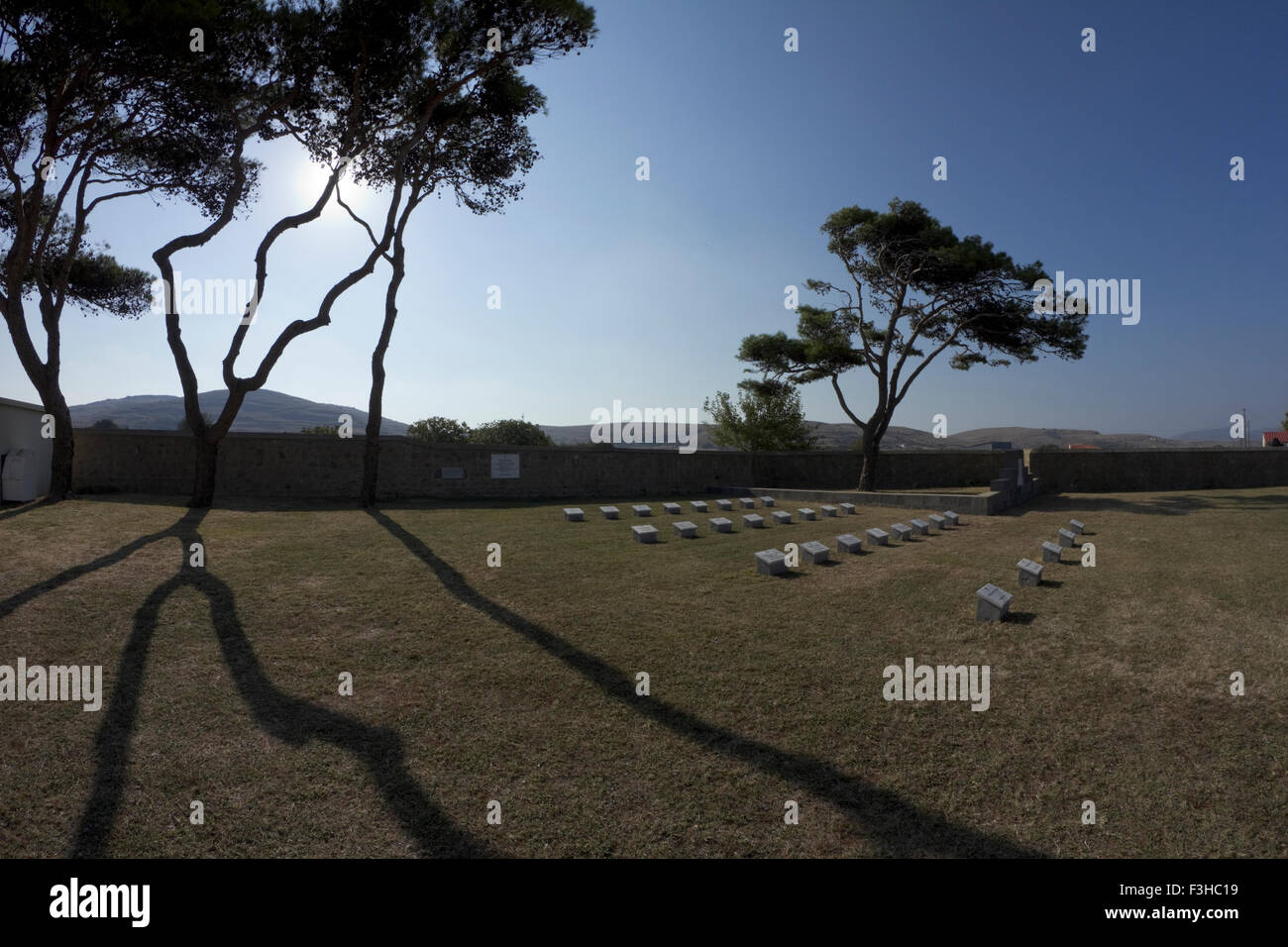 Long tree shadows & the Russian war graves section of the Commonwealth War Graves Commission CWGC, East Mudros Military Cemetery Stock Photo