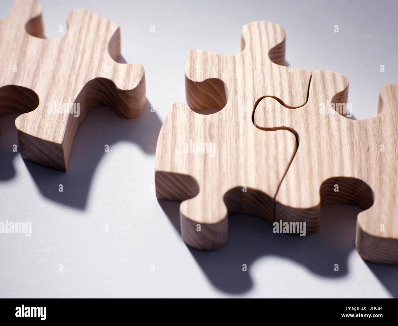 Wooden jigsaw pieces Stock Photo