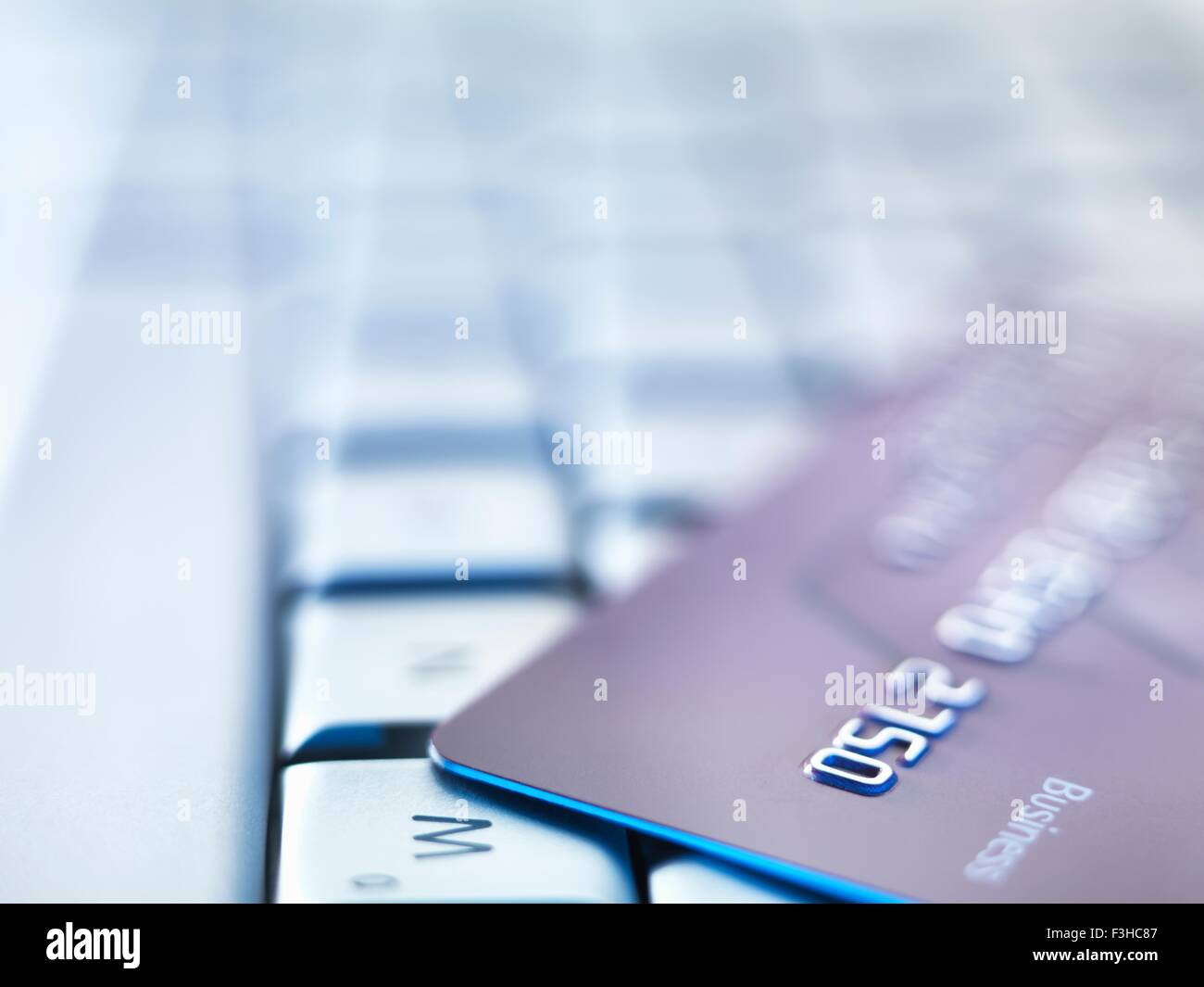Business credit card on laptop keyboard Stock Photo