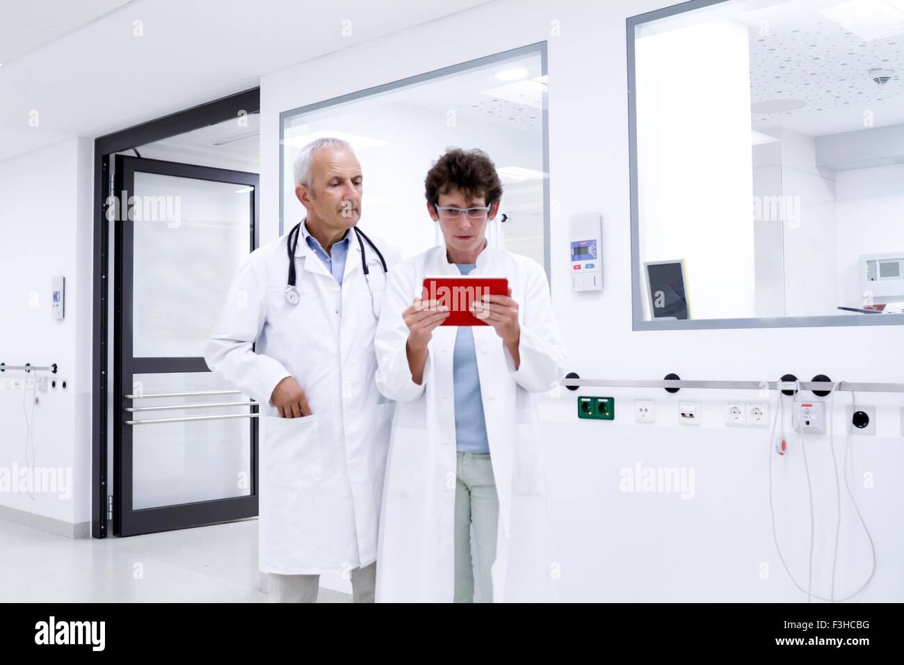 Two doctors looking at digital tablet Stock Photo