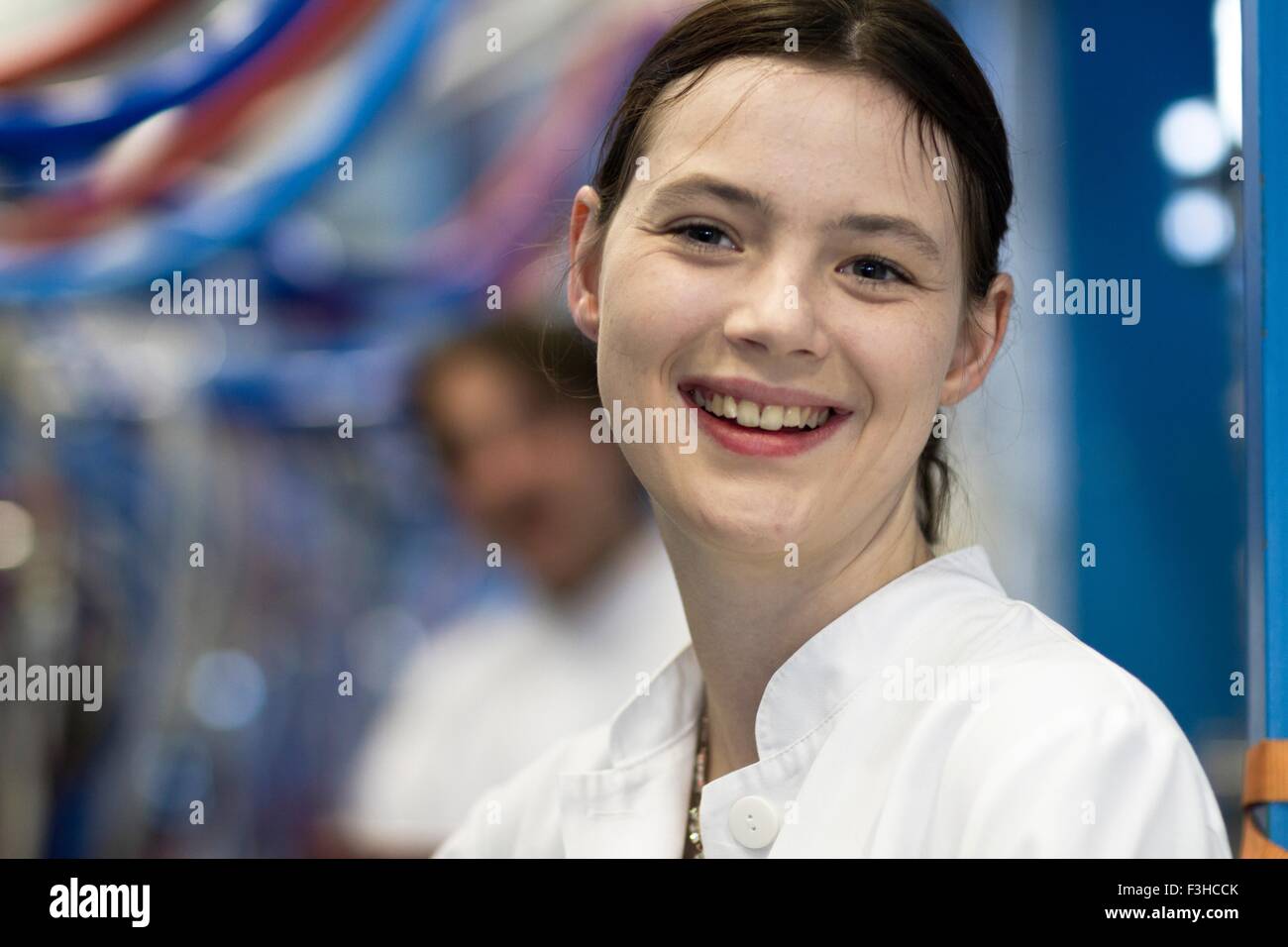 Woman wearing lab coat hi-res stock photography and images - Alamy