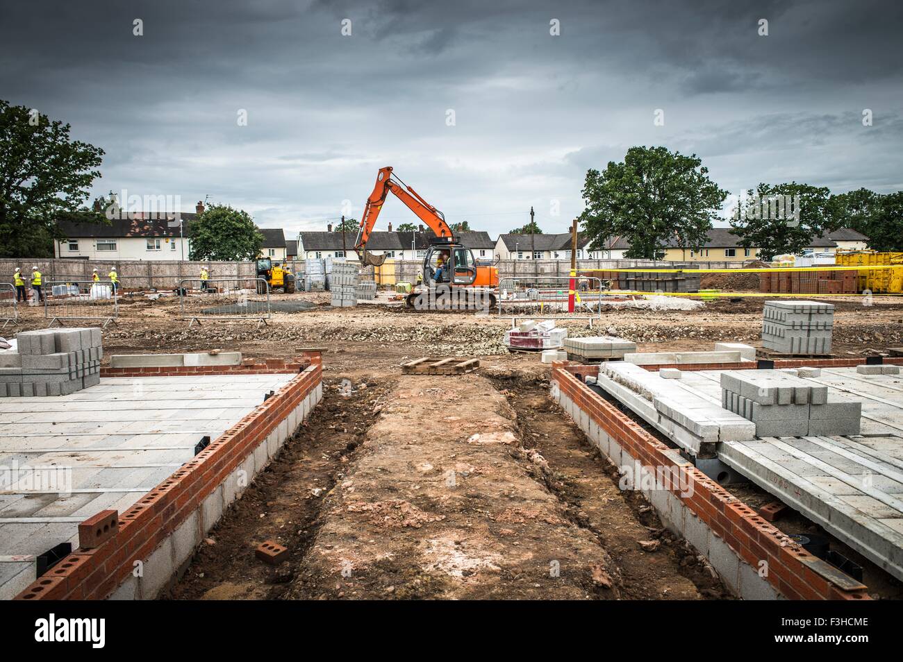 Tractor, building materials on construction site Stock Photo Alamy