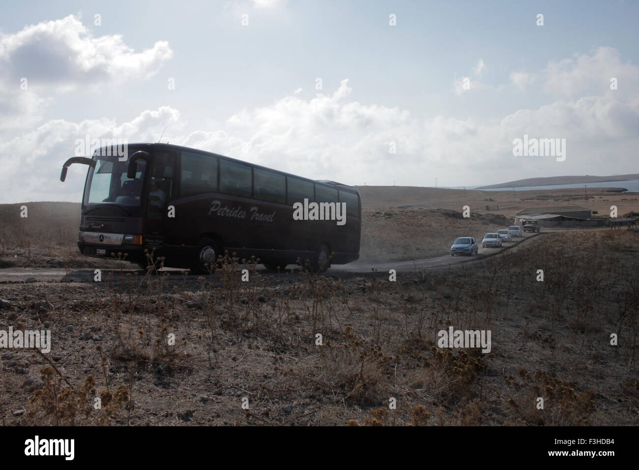 Bus transporting the Russian delegation, arriving at the Russo-Cossack cemetery on cape Punta hill. Lemnos island, Greece Stock Photo