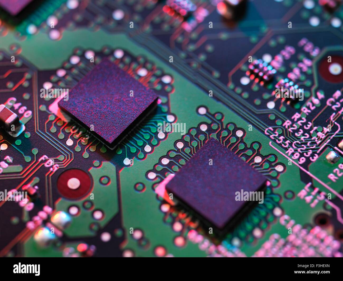 Close up detail of purple and green computer circuit board Stock Photo