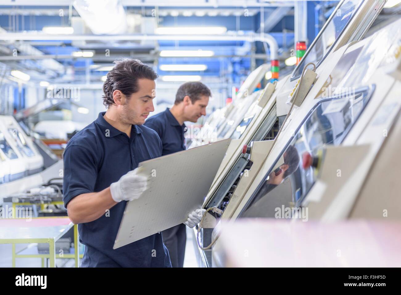 Workers in circuit board manufacturing factory Stock Photo