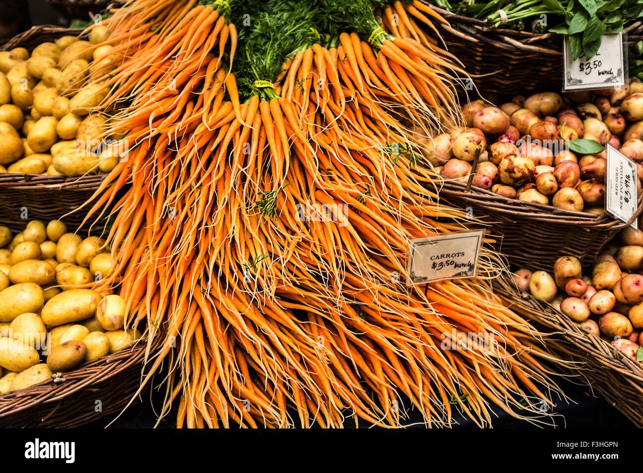 Baby carrots and potatoes Stock Photo Alamy