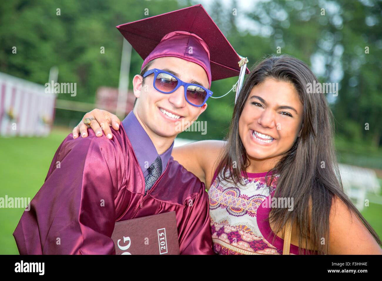 Student celebrates graduation with friend Stock Photo