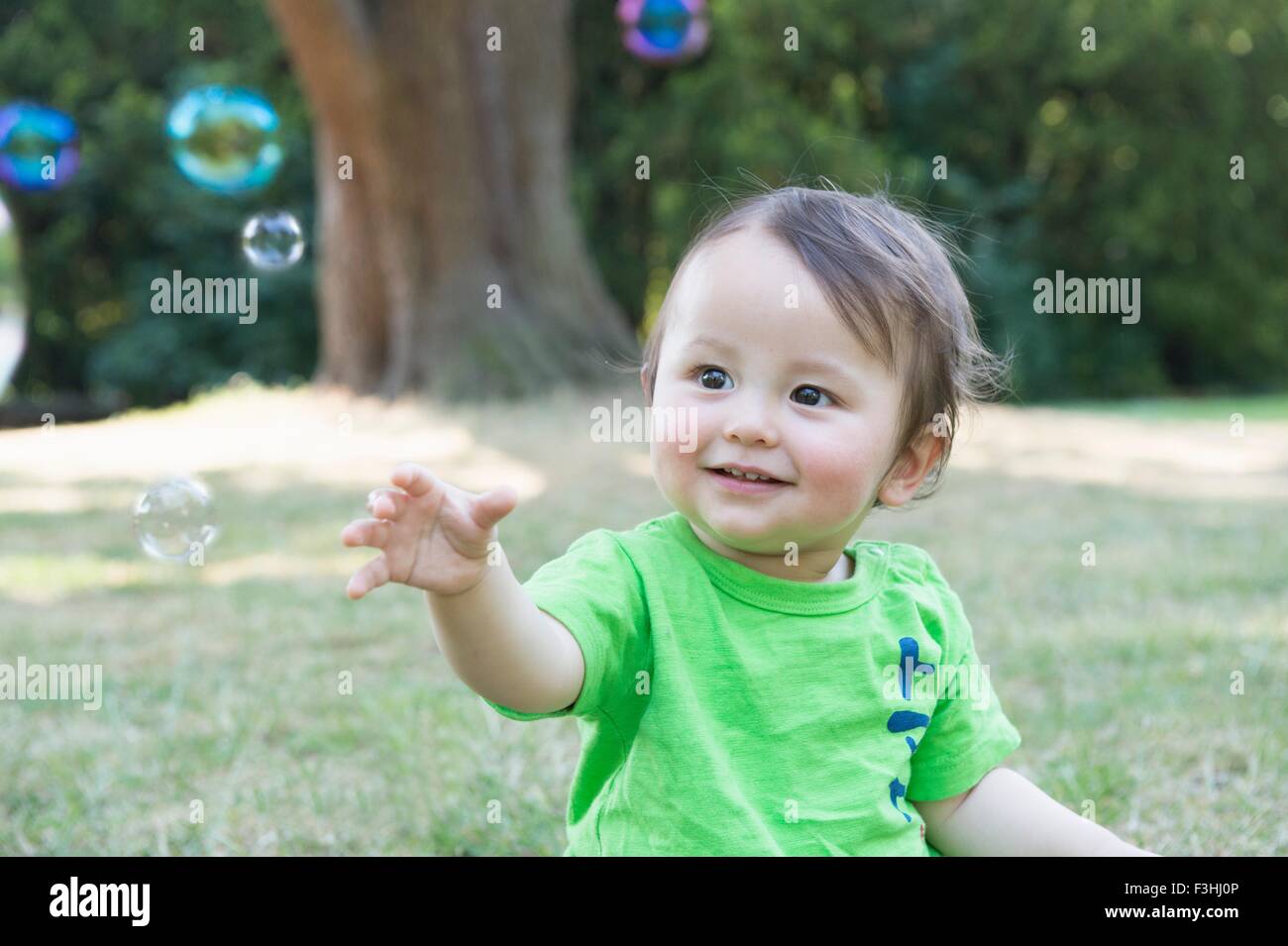 Baby reaching up hi-res stock photography and images - Alamy
