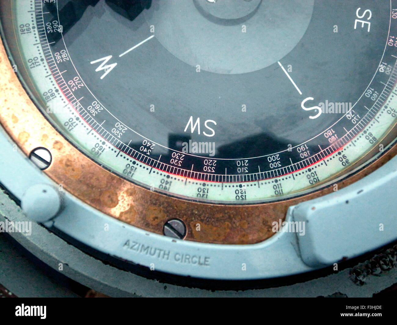 AT SEA. SECTION OF A GYRO REPEATER COMPASS ON BOARD A