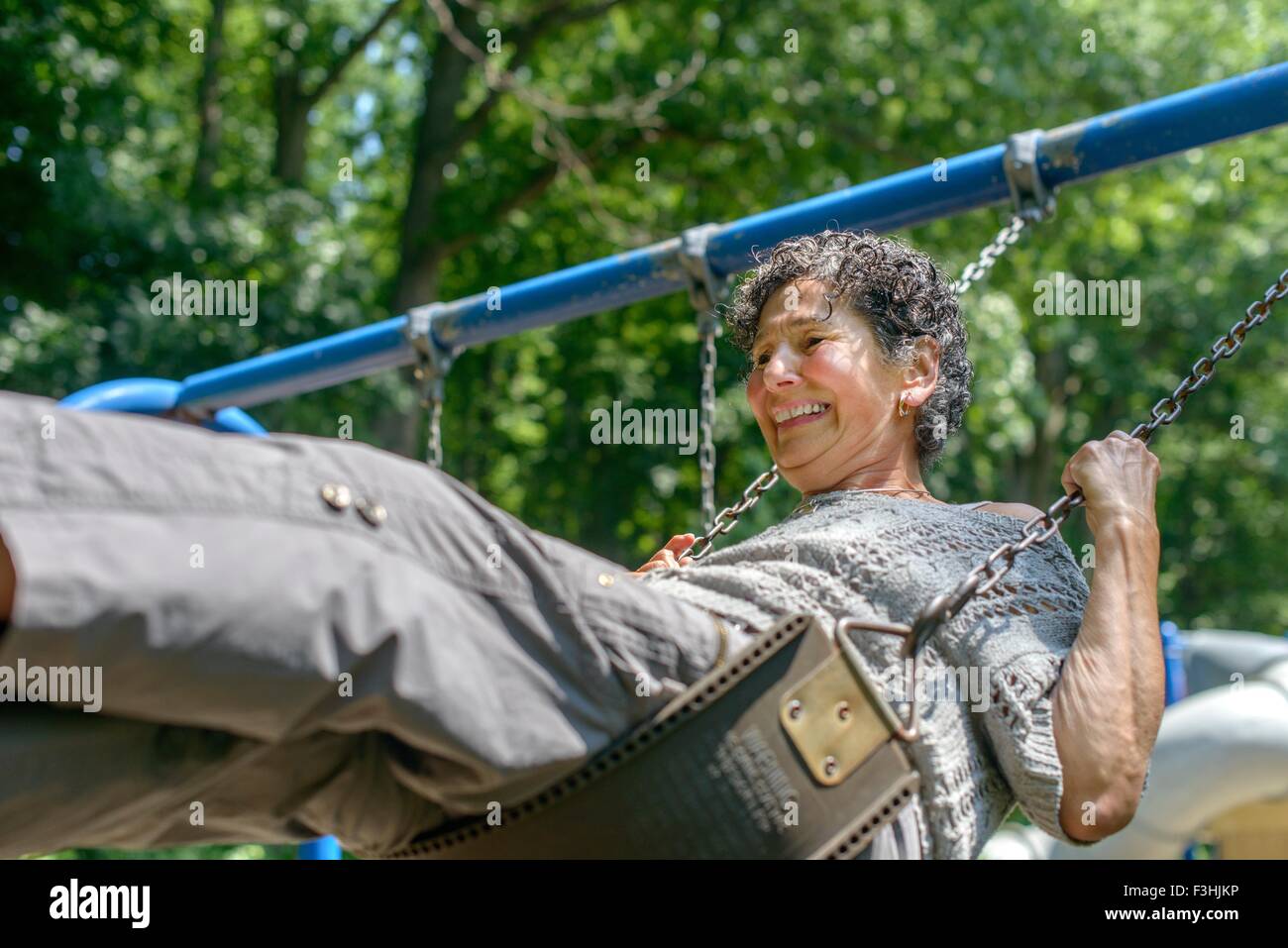 Older woman swinging hi-res stock photography and images - Alamy
