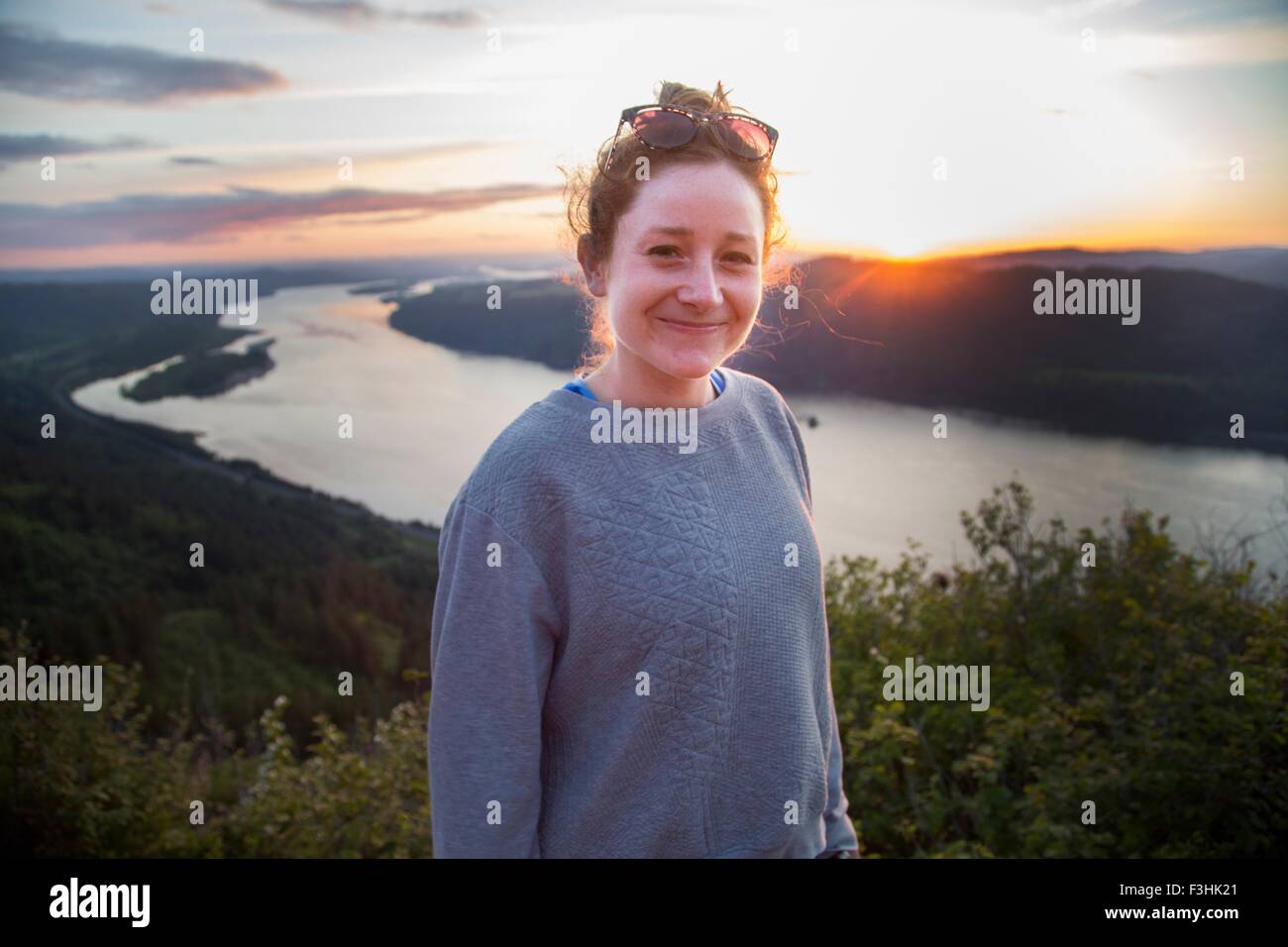 Woman on hill at sunset, Angel's Rest, Columbia River Gorge, Oregon, USA Stock Photo