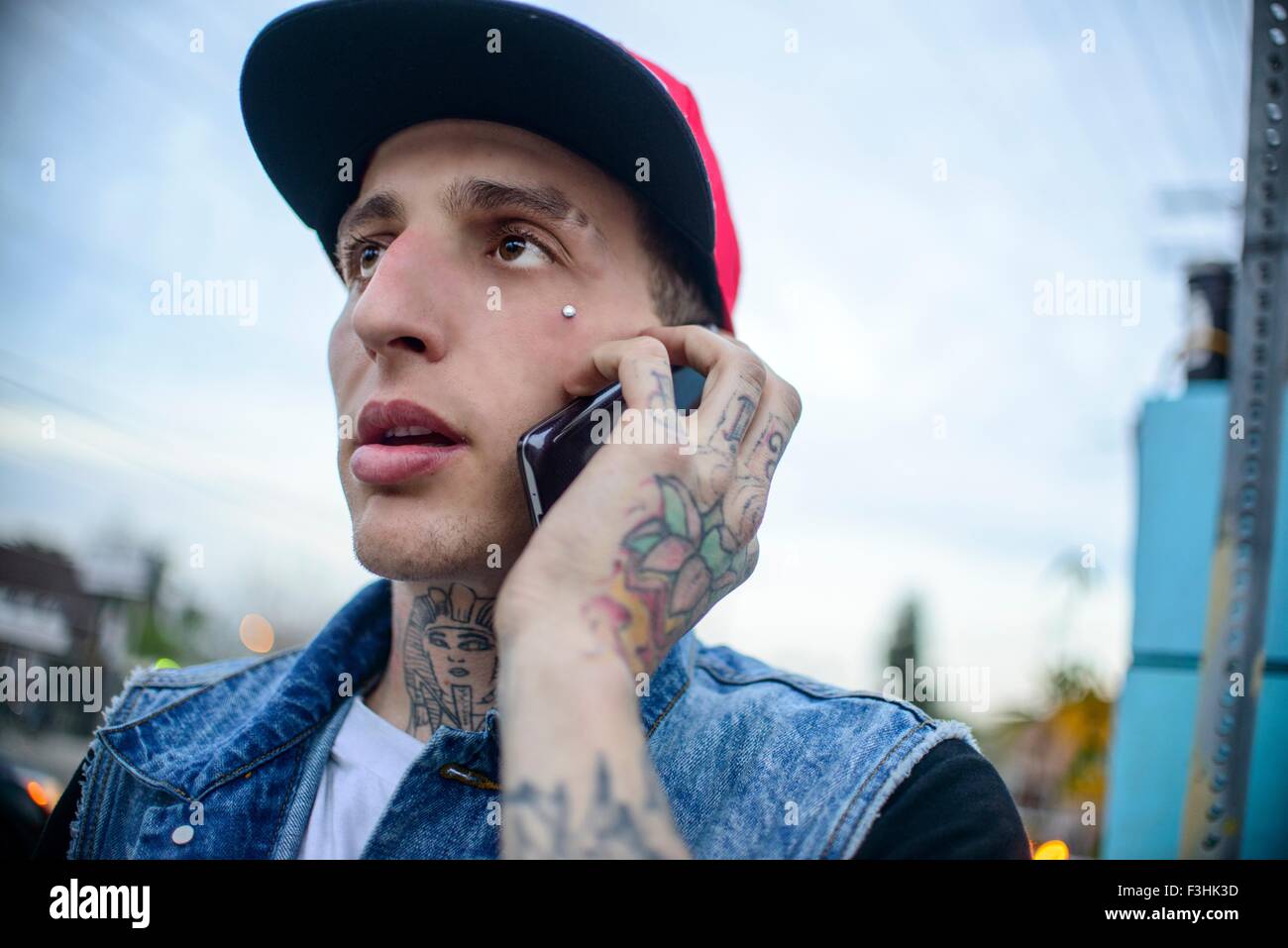 Graffiti artist using smartphone, Venice Beach, California, USA Stock