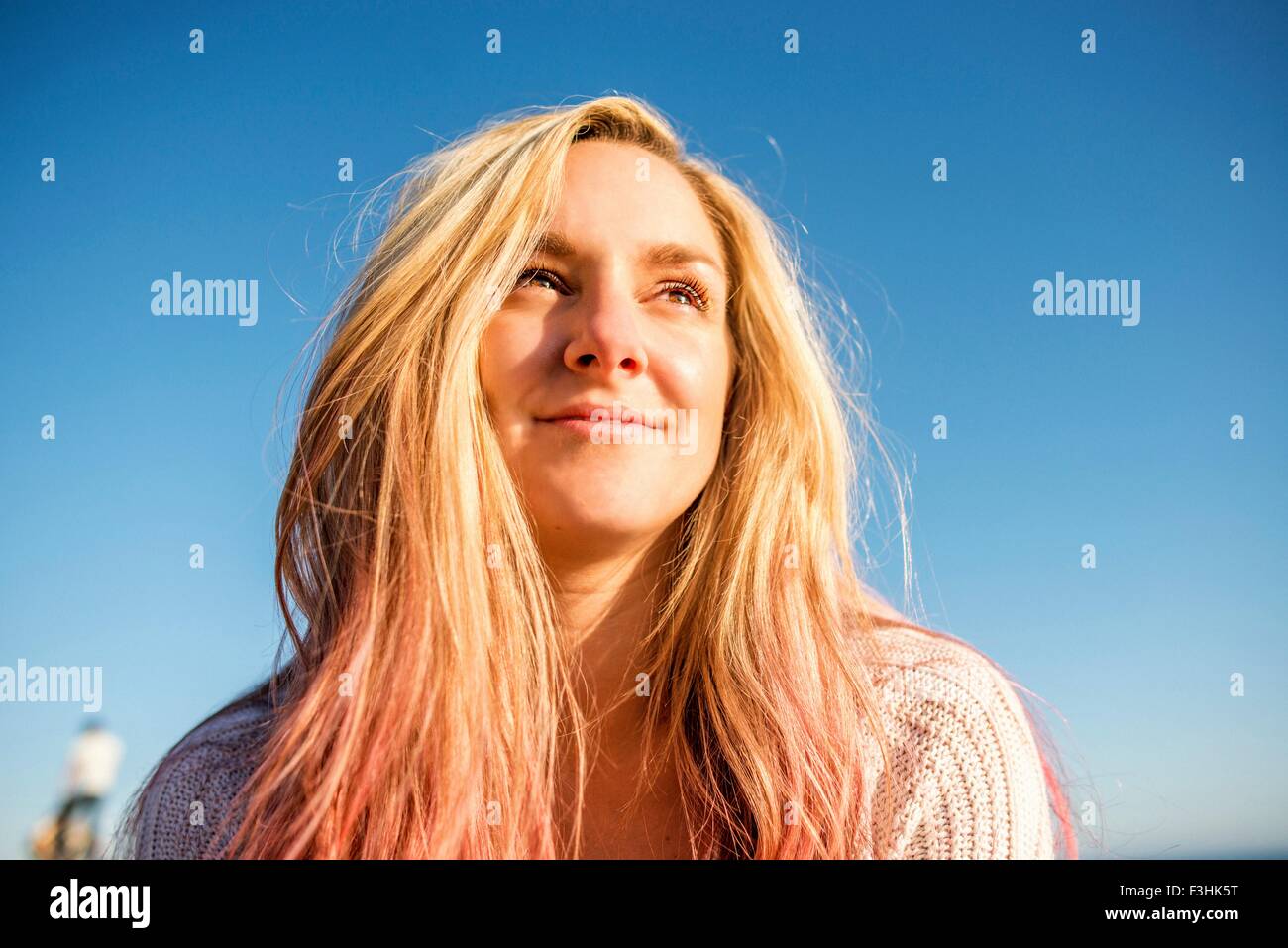 Portrait of woman enjoying sun Stock Photo