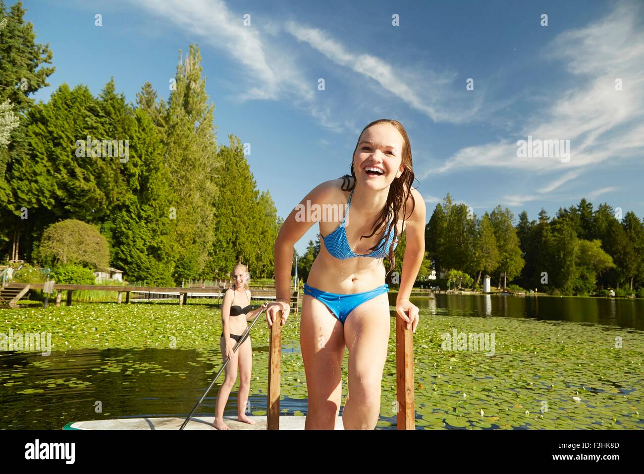 Girls in bikini having fun at lake, Seattle, Washington, USA Stock Photo